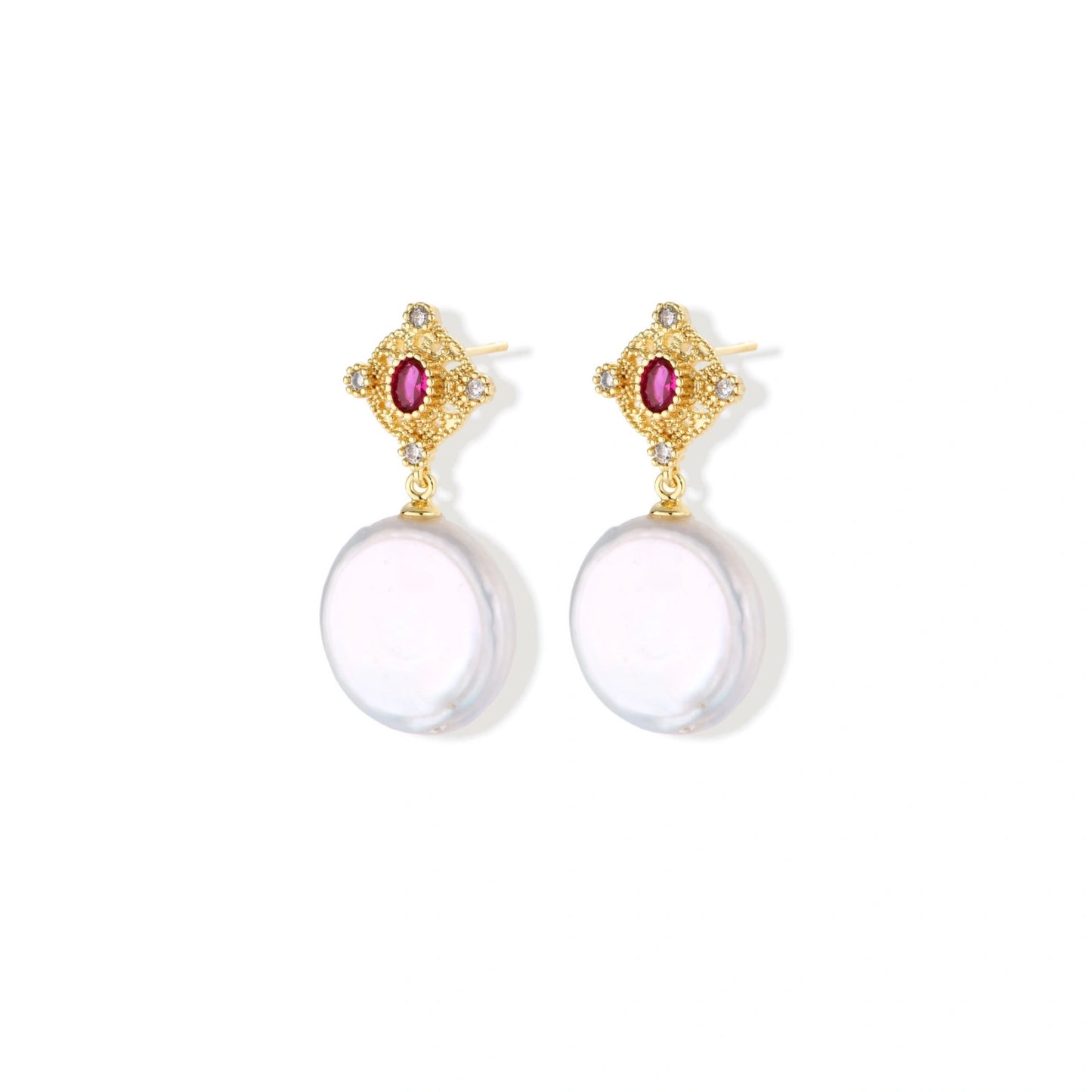 Gold baroque pearl earrings with pink gemstone studs and ornate detailing on cream background.