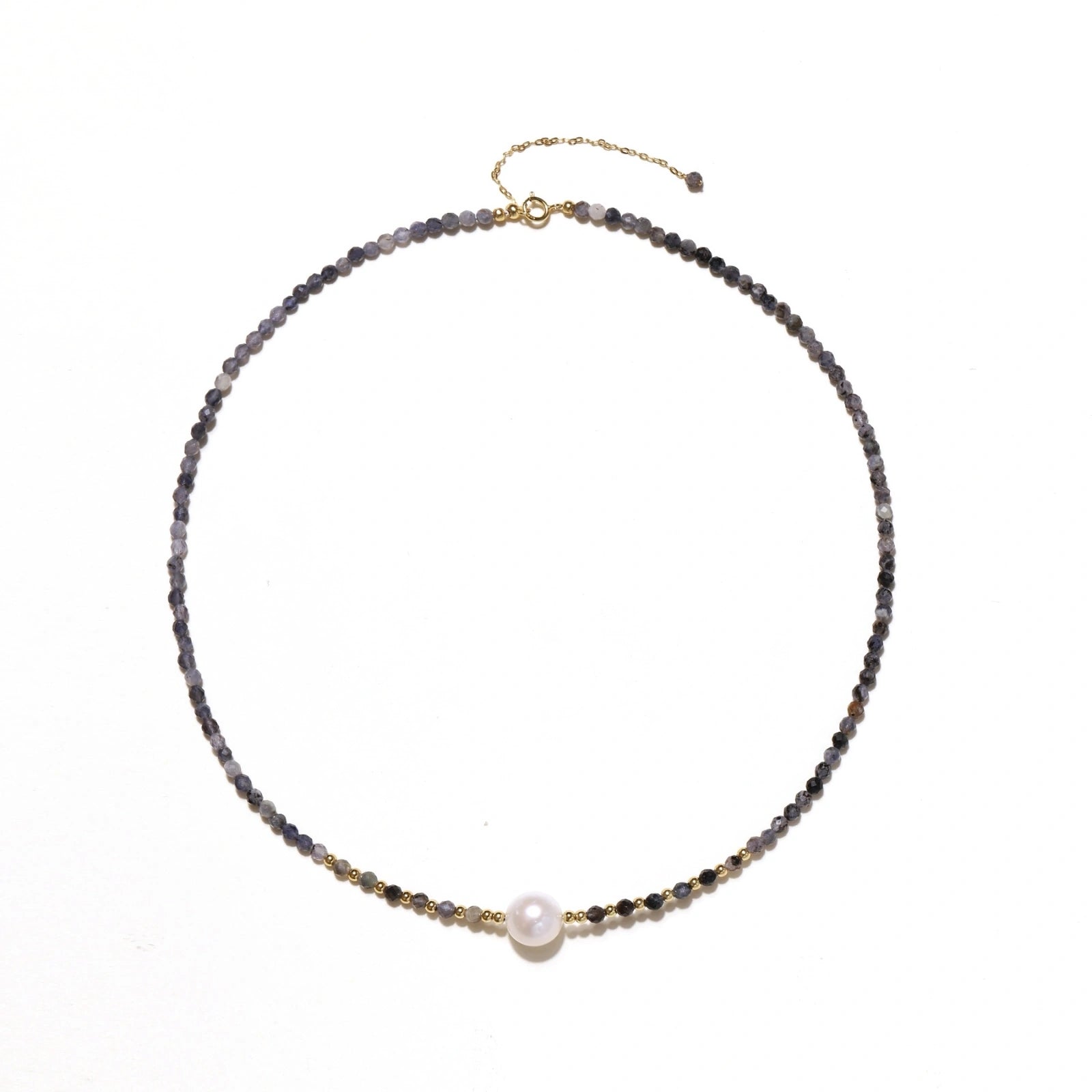 Dainty necklace with faceted purple iolite beads, gold vermeil accents, and central pink-white freshwater pearl.