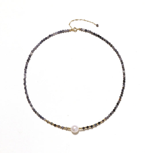 Dainty necklace with faceted purple iolite beads, gold vermeil accents, and central pink-white freshwater pearl.