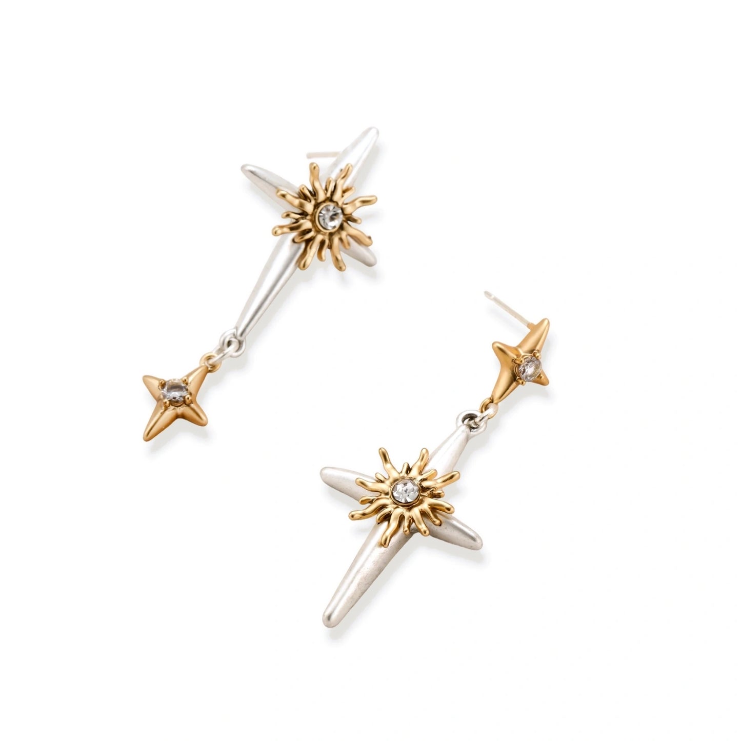 Layered silver-toned necklace set with cross pendant and gold sun charm detail, matching drop earrings on white background.
